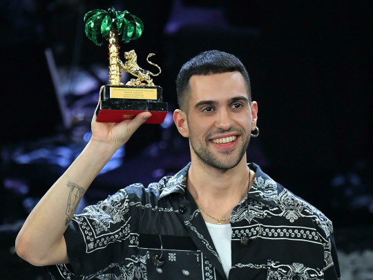 Italian singer Mahmood celebrates on stage after winning the 69th Sanremo Italian Song Festival at the Ariston theater in Sanremo, Italy, on Saturday, Feb. 9, 2019. (Ettore Ferrari/ANSA via AP)